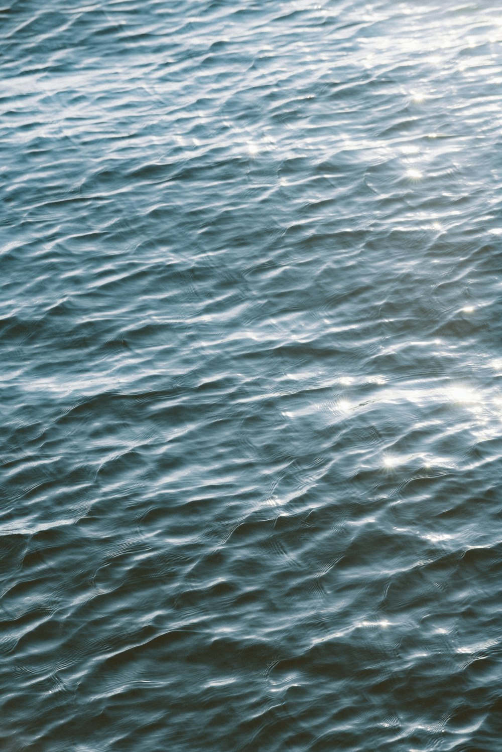 a boat floating on top of a large body of water