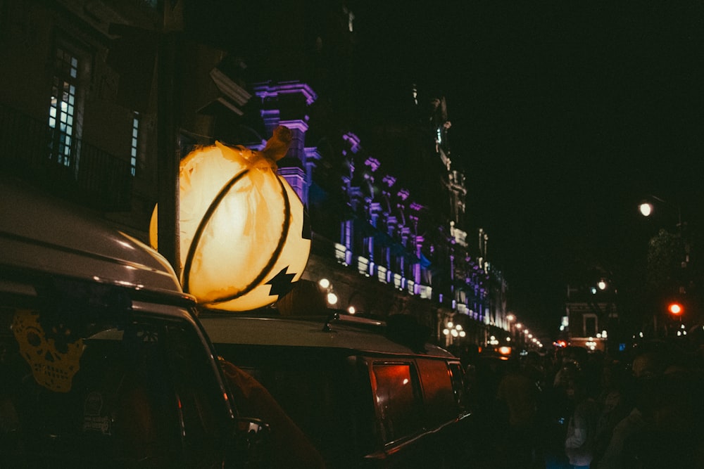 a car parked on the side of a street at night