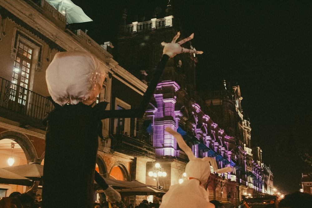 a couple of people that are standing in the street