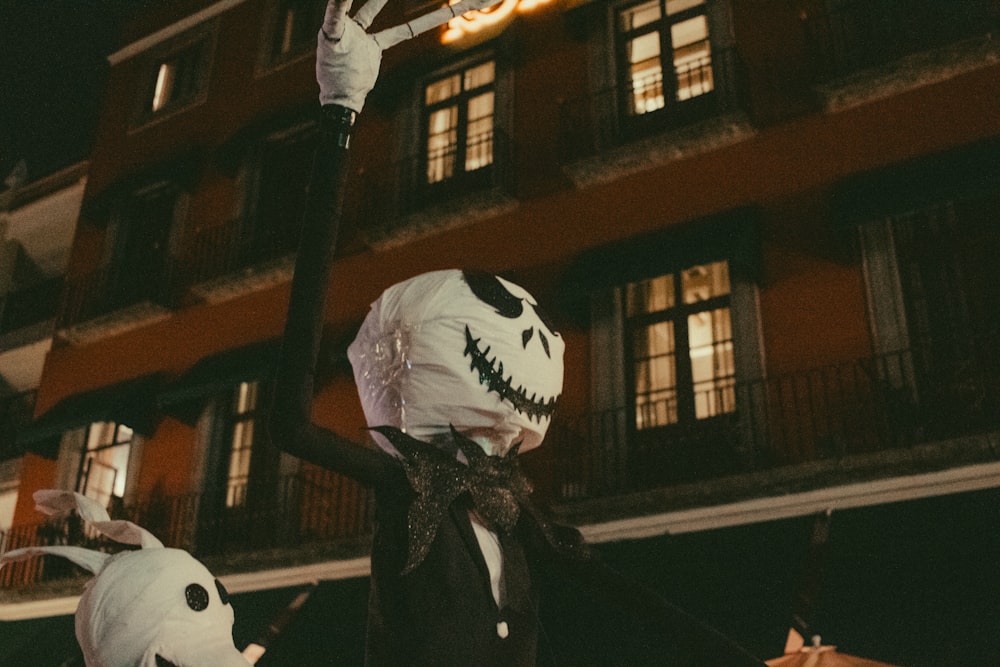 a street light decorated like a jack - o - lantern and a jack - o