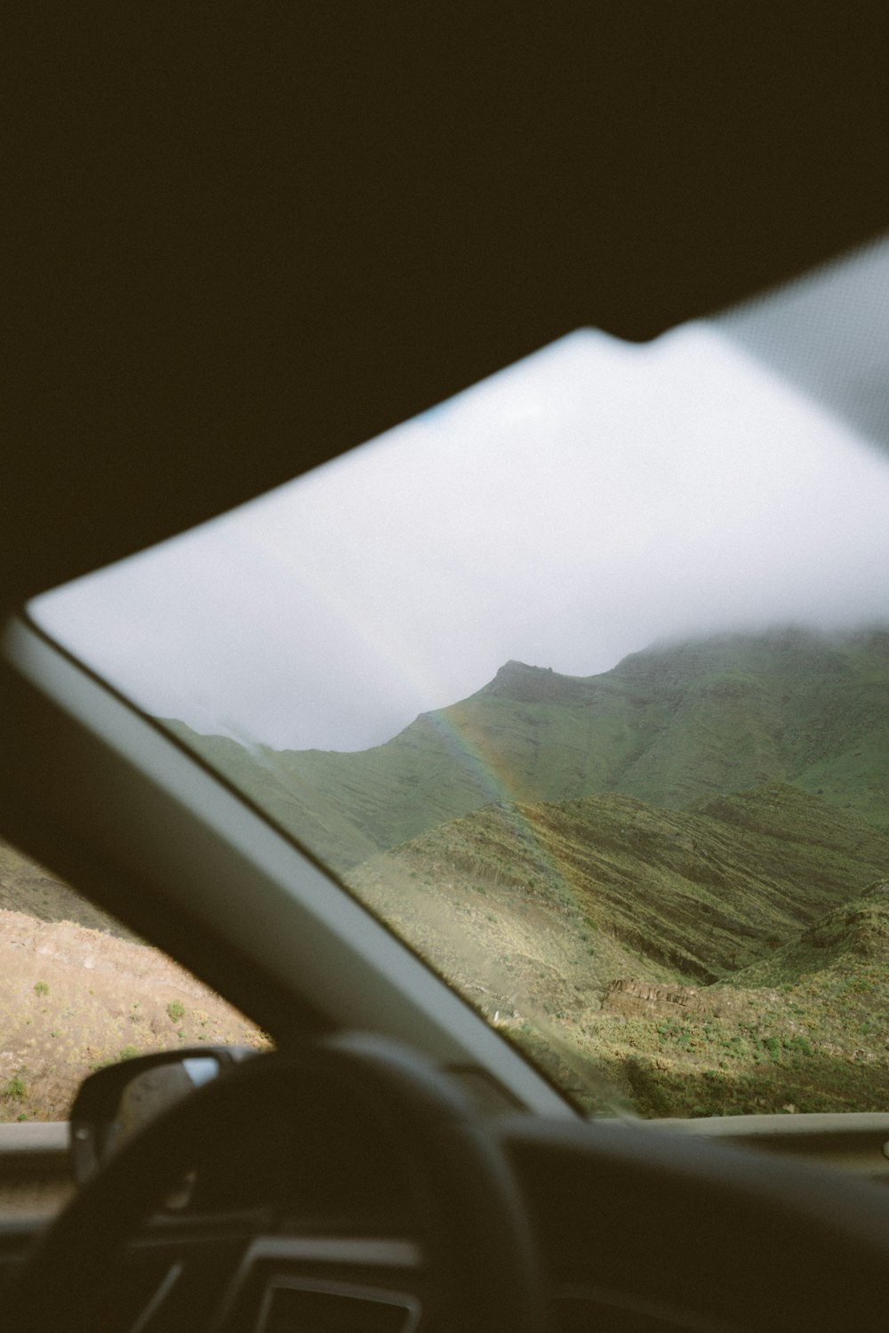 a view from inside a car of a mountain range