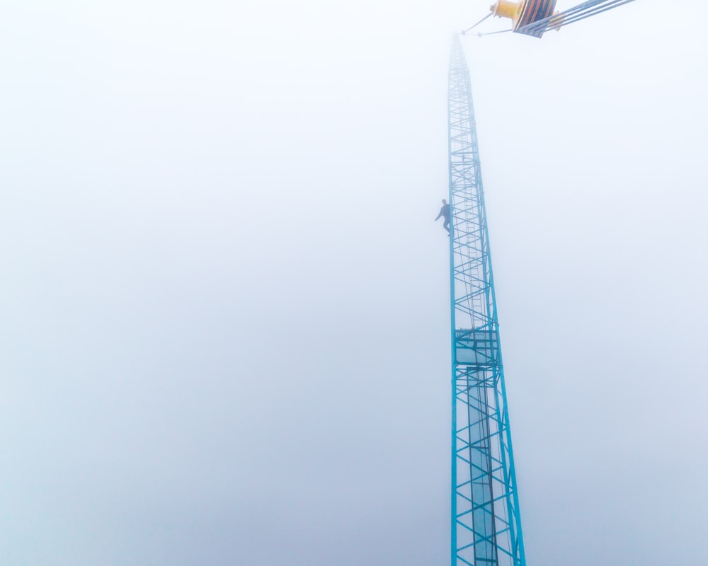 a tall tower with a traffic light on top of it