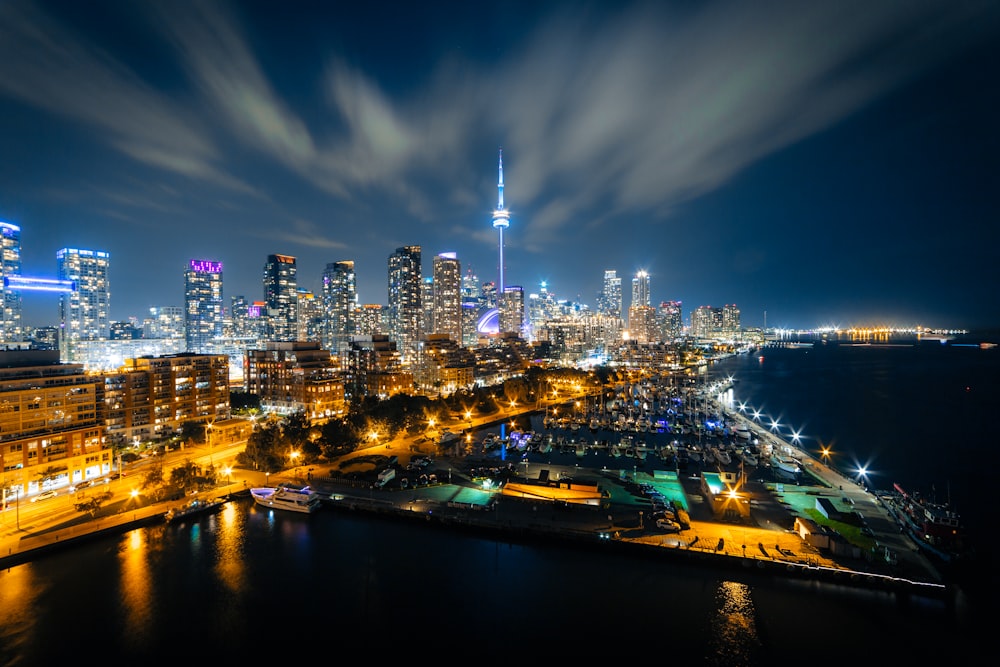 a view of a city at night from the top of a hill