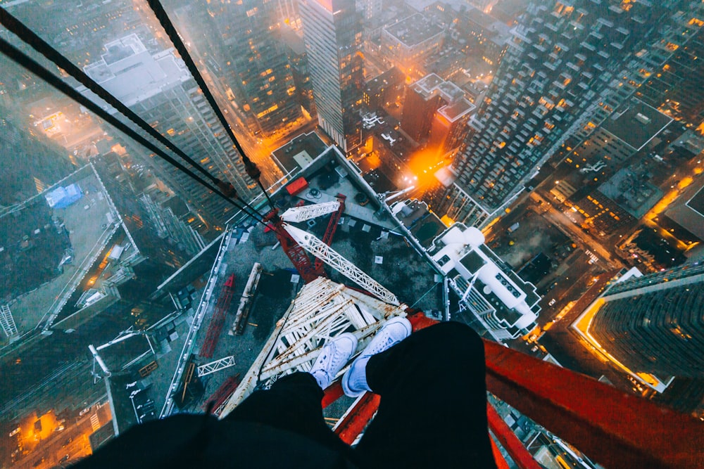 a person standing on top of a tall building