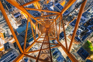 an aerial view of a tall structure in a city