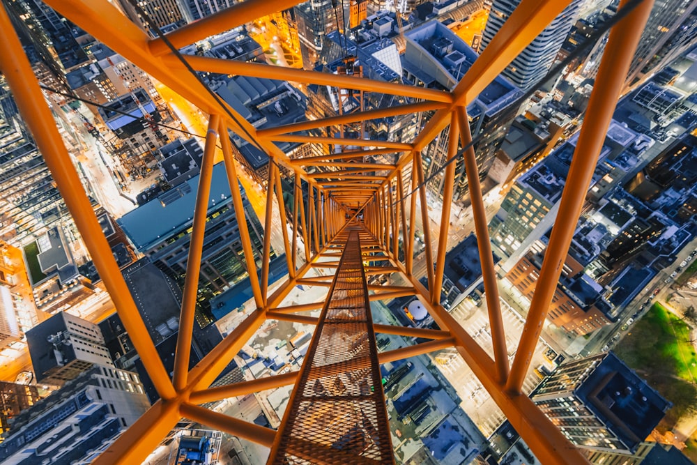 an aerial view of a tall structure in a city