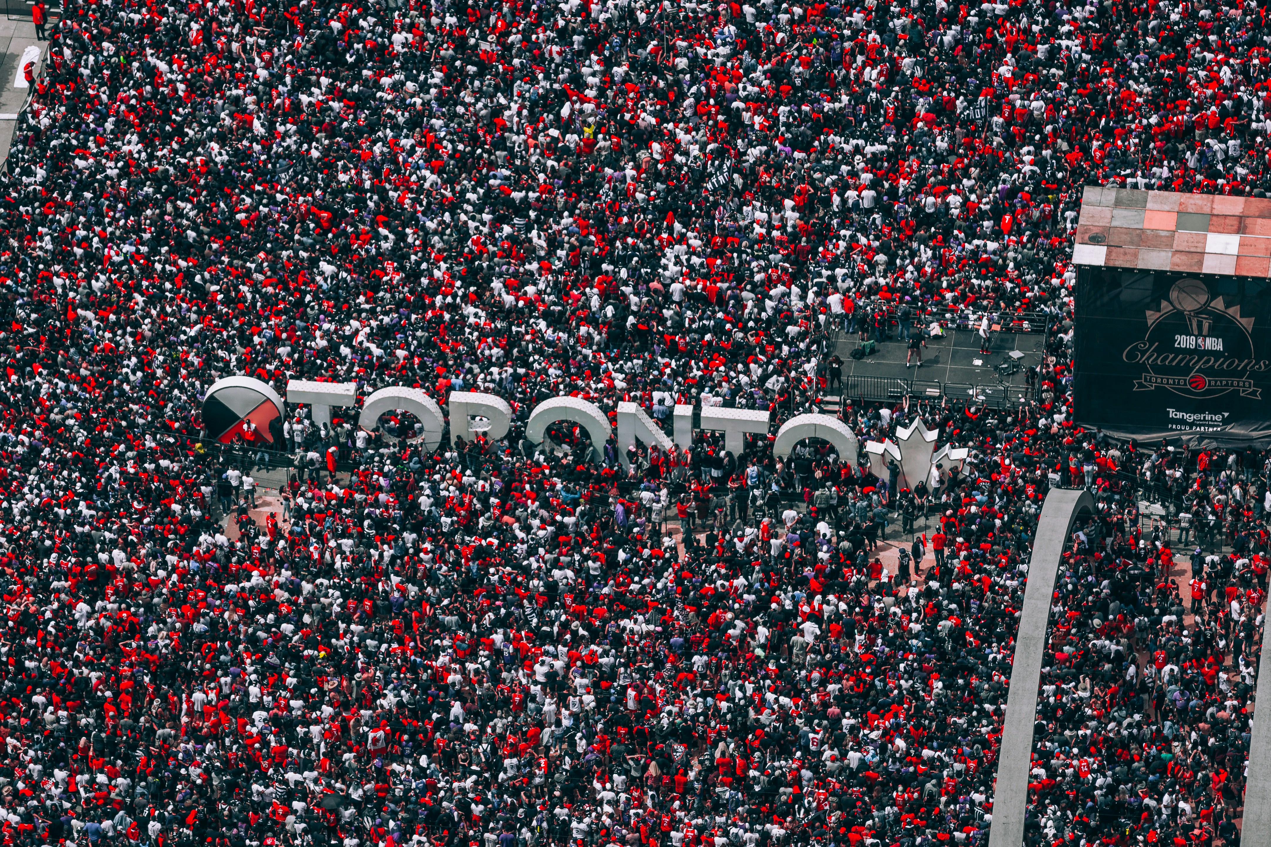 a large crowd of people are gathered in a stadium