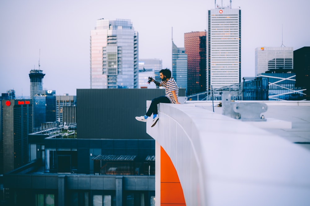 a man riding a skateboard down the side of a tall building