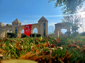 The main entrance of Daruchchunnah Kamil Madrasa with clear signage and greenery around.