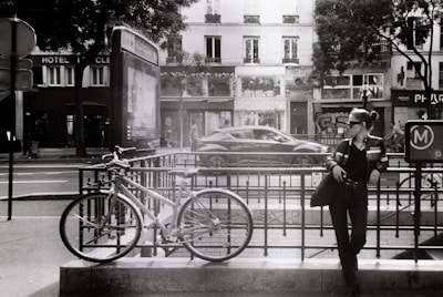 An urban scene featuring a woman in a leather jacket.