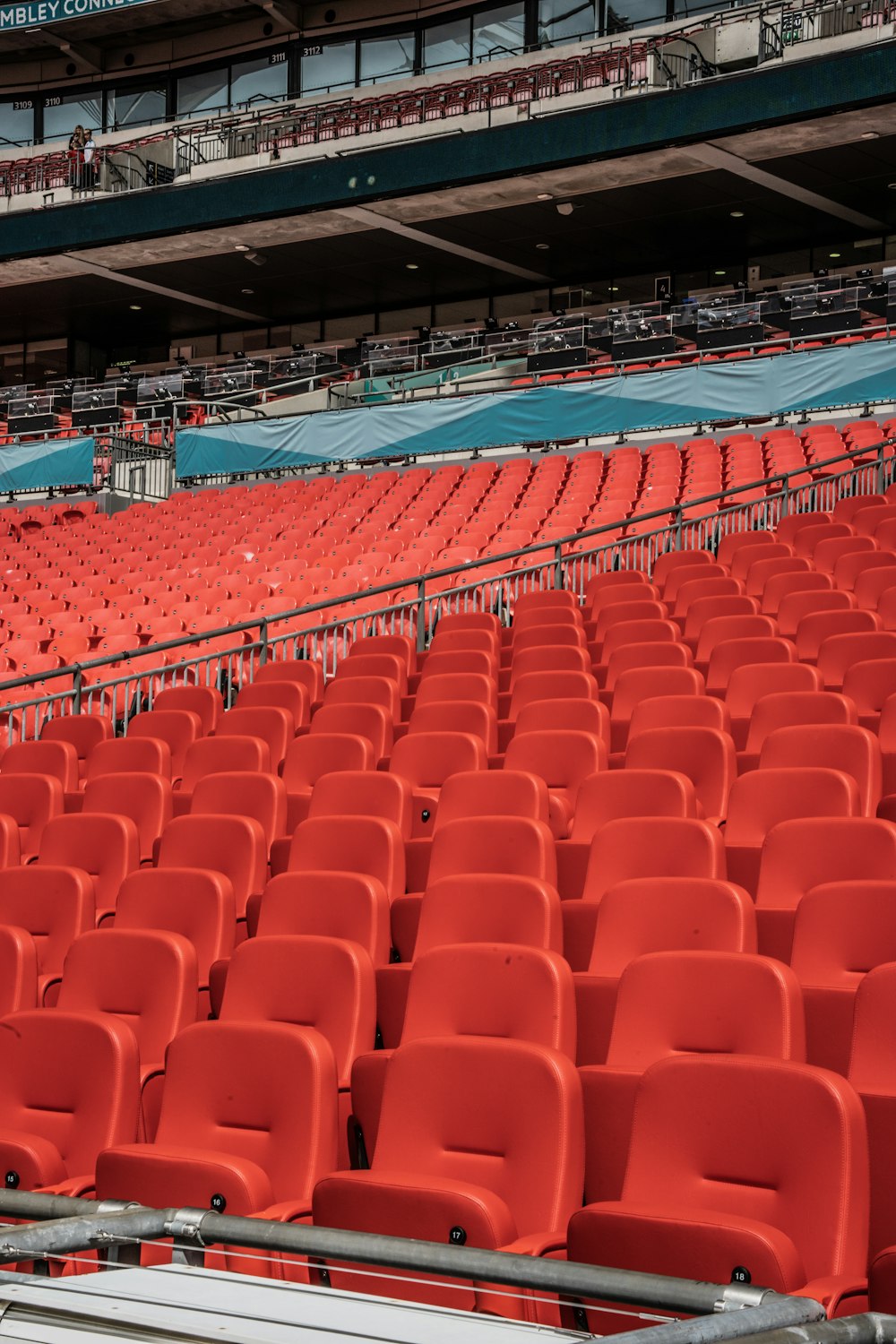 a stadium filled with lots of red chairs