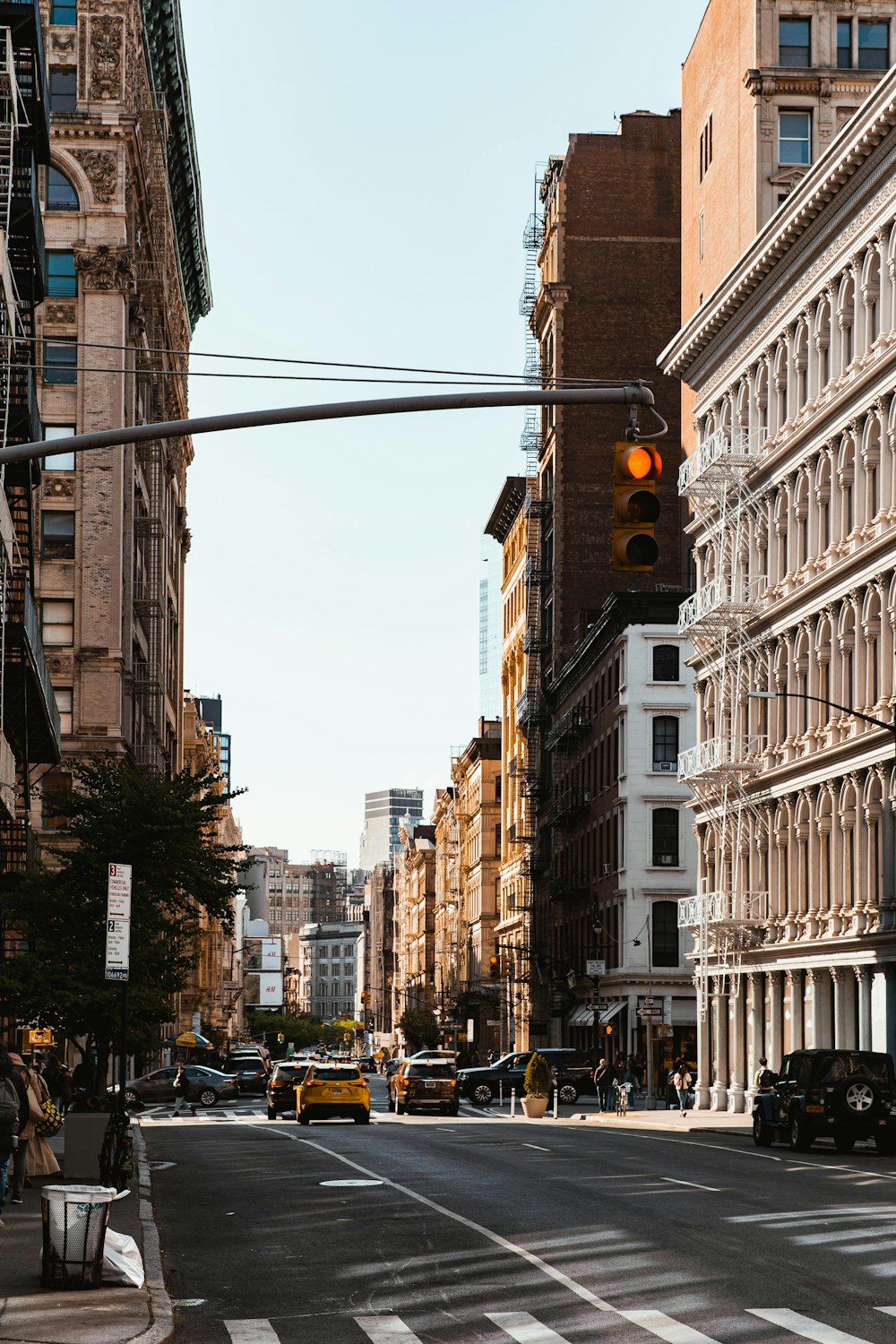 a traffic light hanging over a street filled with traffic