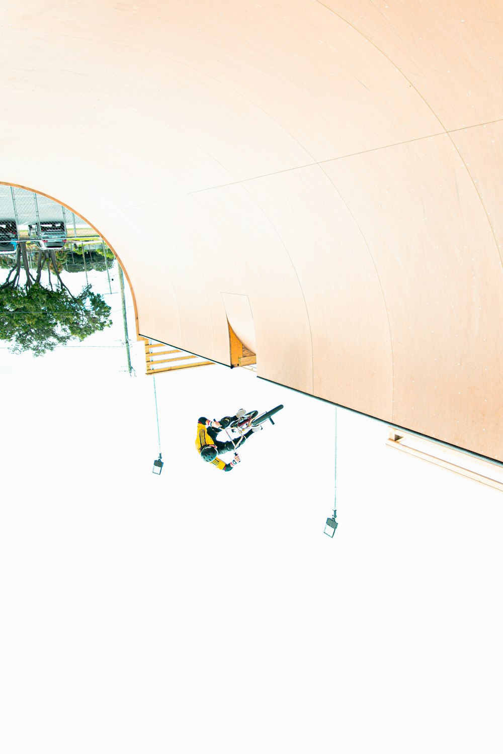 a man riding skis down the side of a snow covered slope