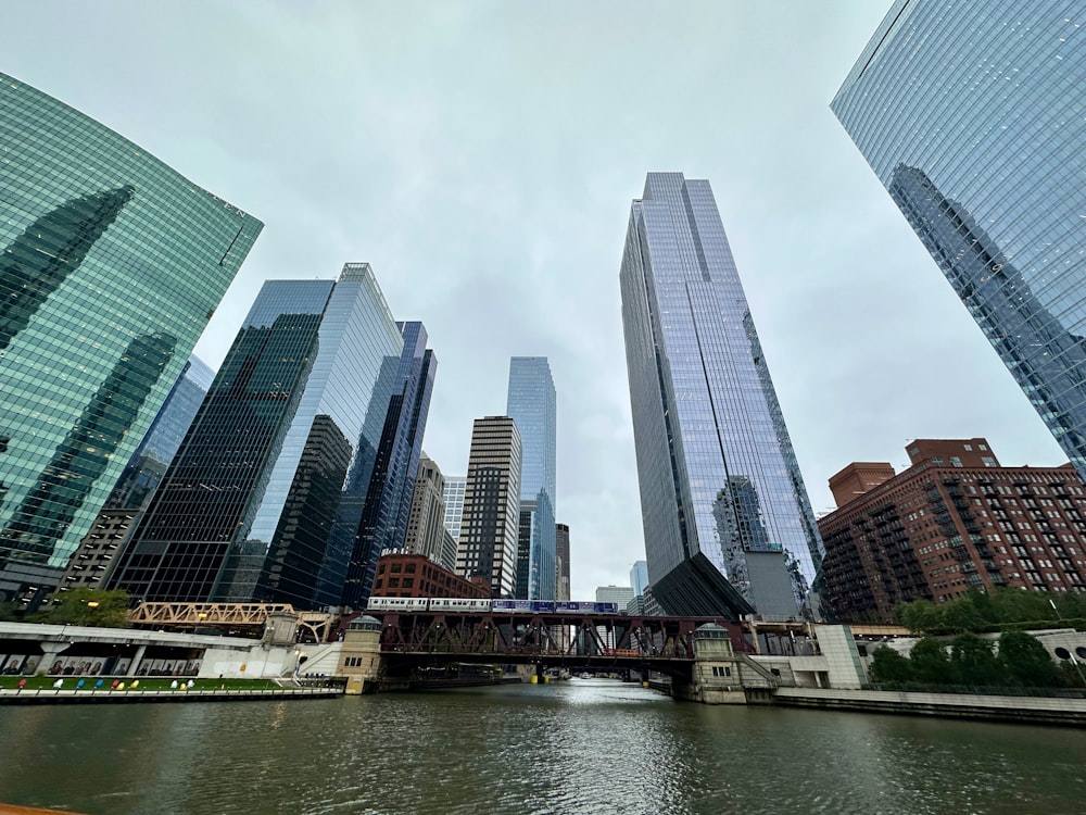 a river runs through a city with tall buildings