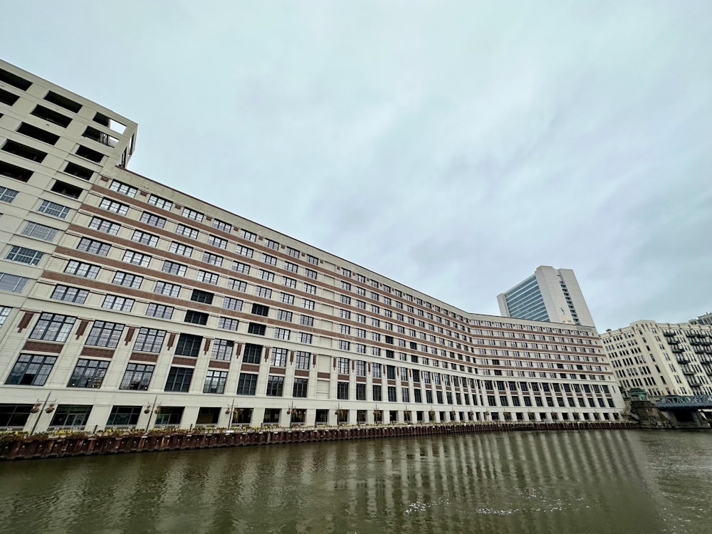 a large building sitting next to a body of water