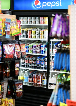a pepsi vending machine in a grocery store