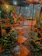 A cozy backyard garden with lush greenery and a stone pathway at sunset.