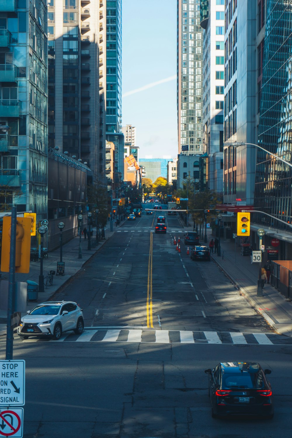 a city street with cars driving down it