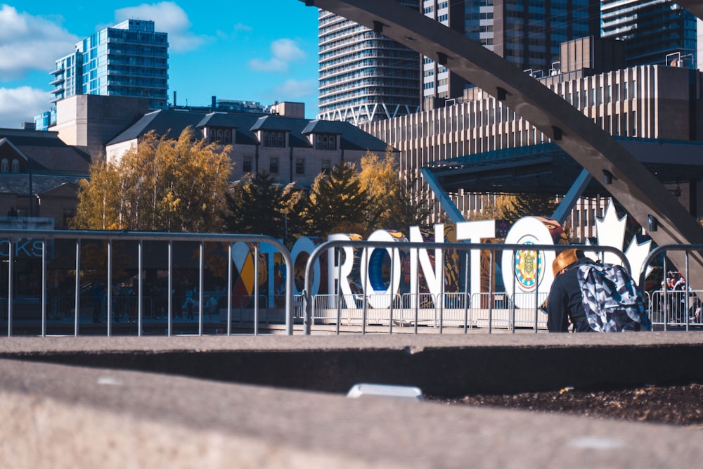 a person walking across a bridge over a river