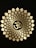 A detailed pattern of petals radiates outwards from a central Om symbol, which is prominently displayed in a golden hue against a dark background. The pattern is symmetrical, creating a sense of balance and harmony.