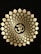 A detailed pattern of petals radiates outwards from a central Om symbol, which is prominently displayed in a golden hue against a dark background. The pattern is symmetrical, creating a sense of balance and harmony.