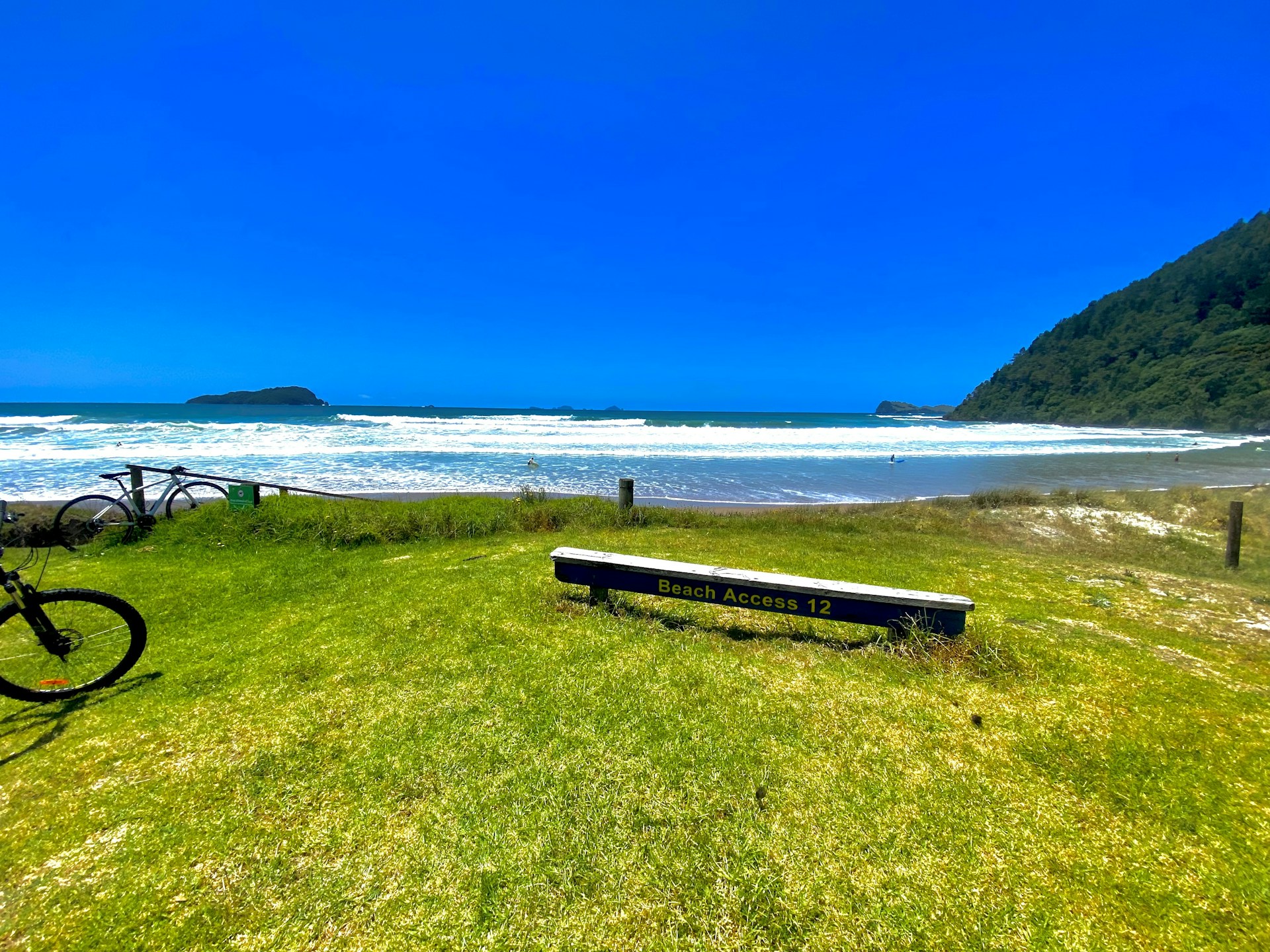 woman wearing yellow long-sleeved dress under white clouds and blue sky during daytime