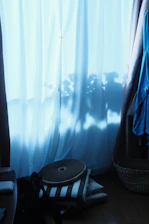Close-up of beautifully woven bamboo curtains hanging in a sunlit room.