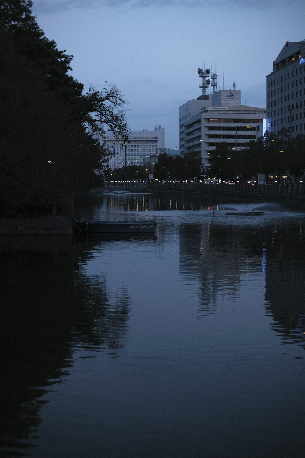 a body of water surrounded by tall buildings