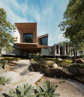 a house on a hill surrounded by trees and rocks