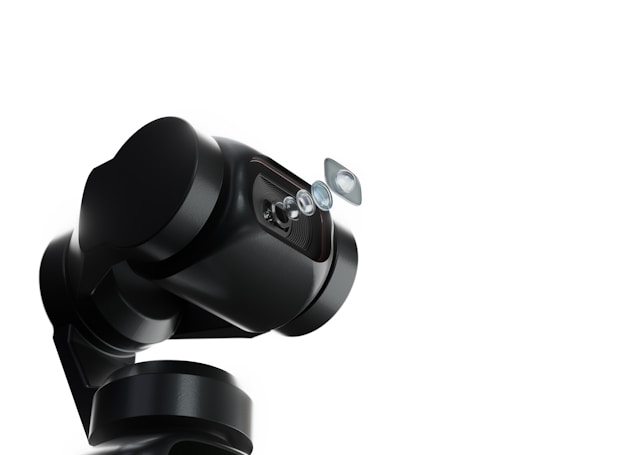 A robotic arm with a sleek, black design holds a series of lenses that appear to be suspended in mid-air. The background is a stark white, emphasizing the mechanical and sophisticated nature of the robotic technology.