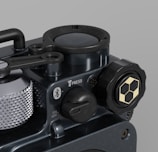 Close-up of a sleek electromechanical medical device with blue and grey accents.