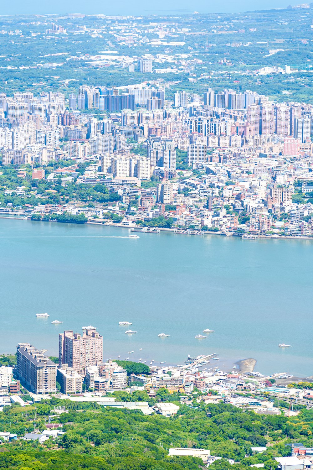 an aerial view of a city and a body of water