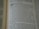 A close-up of an open book displaying a page with text. The layout is divided into sections with bold headings and numbered lists. The font is clear, and the lines of text are closely spaced. The lighting highlights the text, making it easy to read.