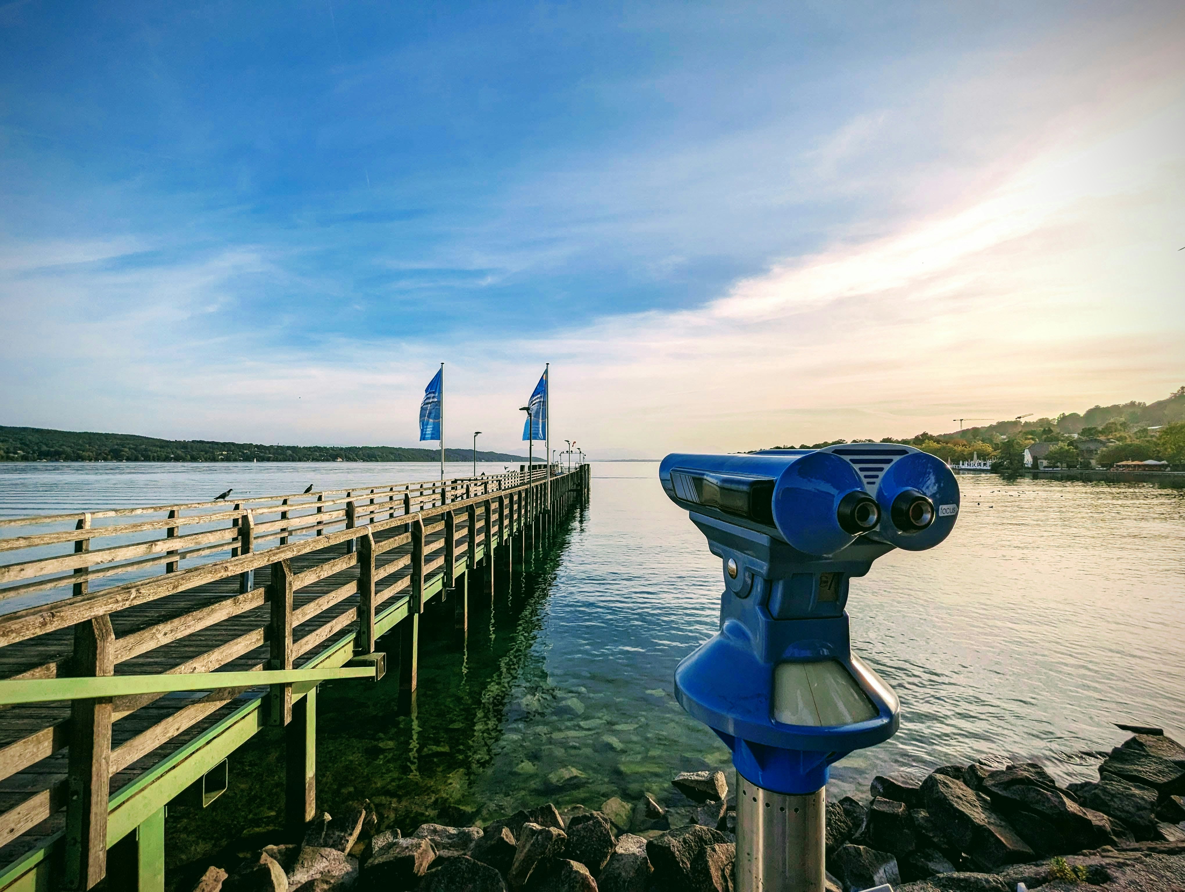 a view of a pier with a boat in the background