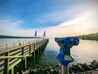 a view of a pier with a boat in the background