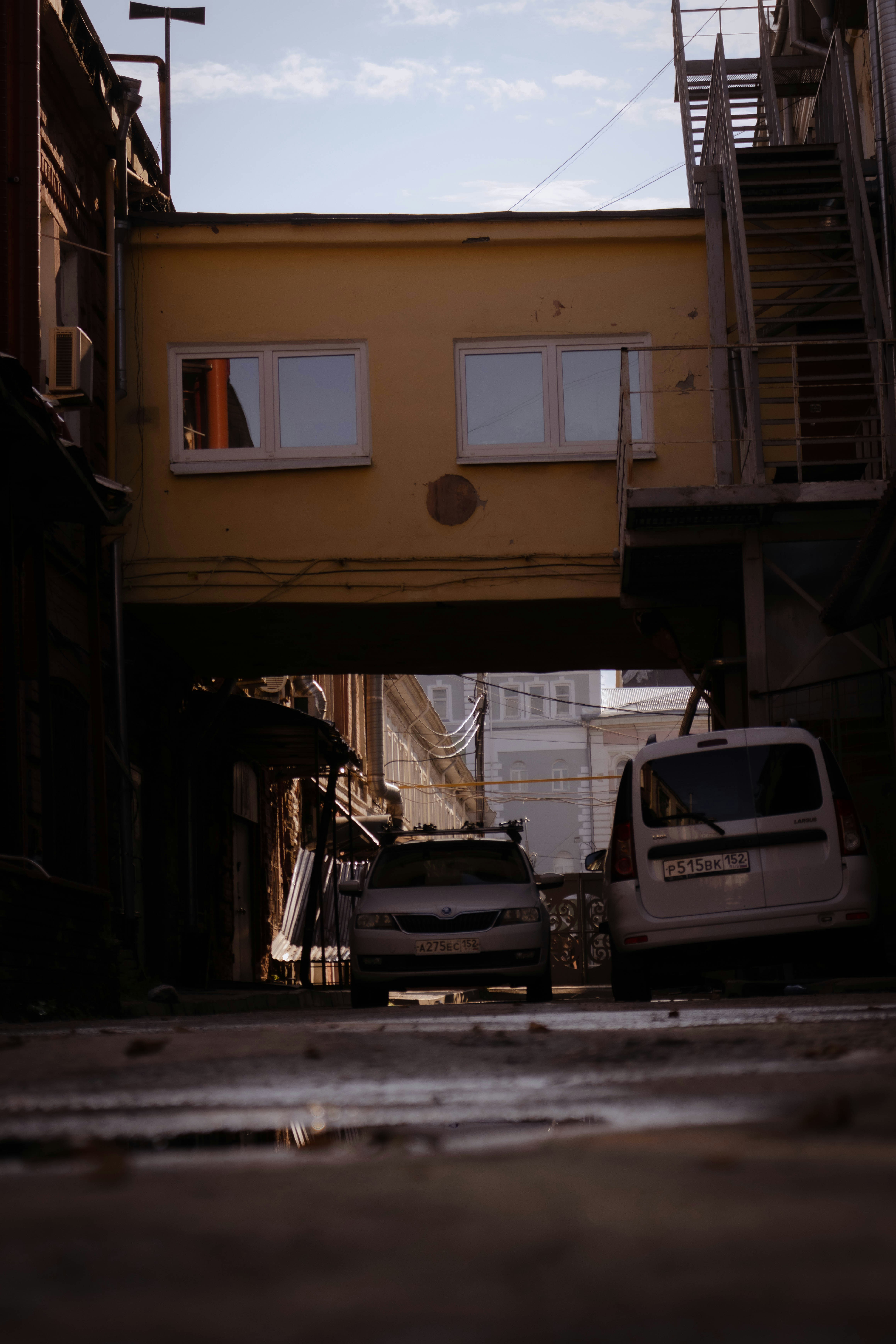 a couple of trucks that are parked under a bridge