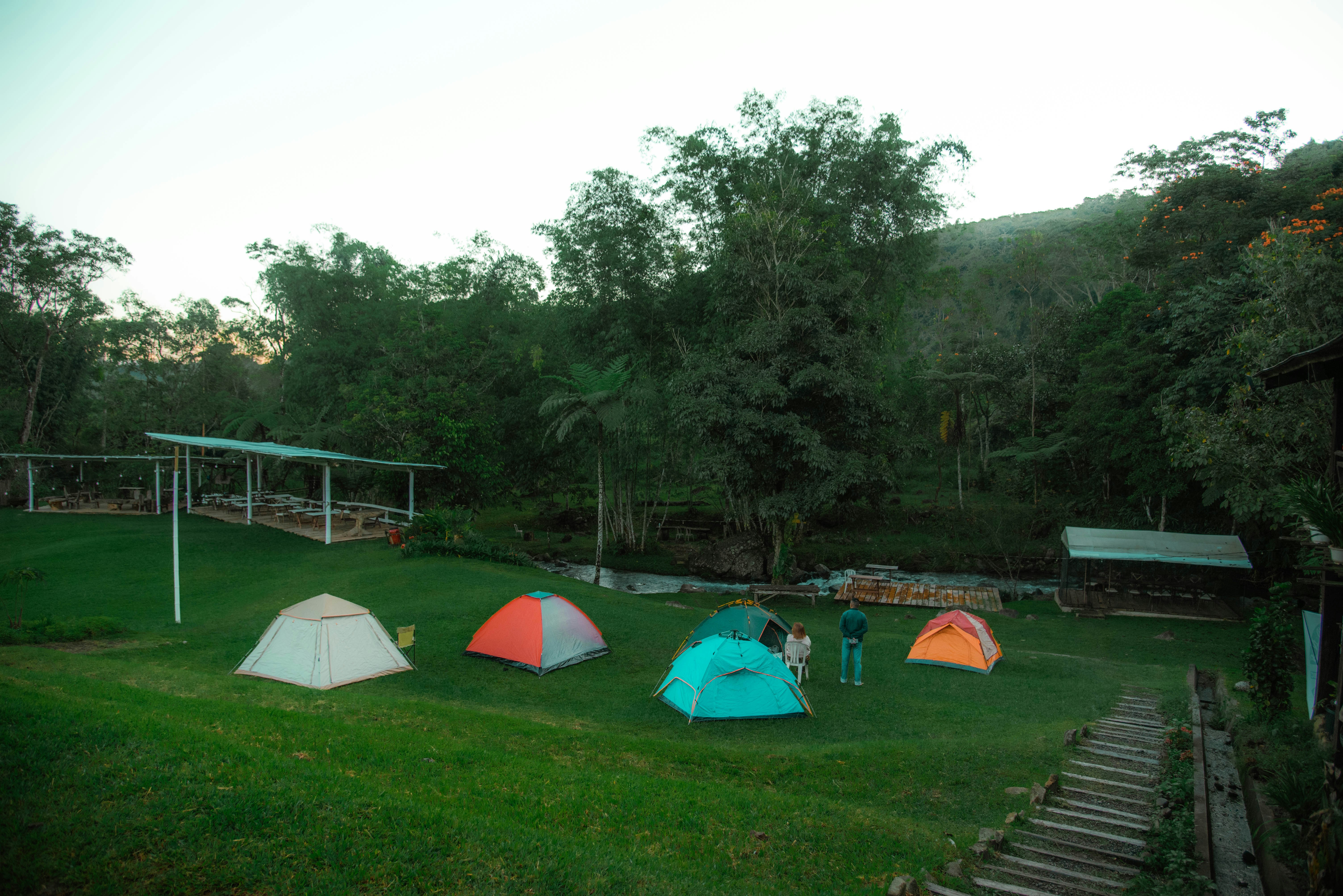 Tents in green field