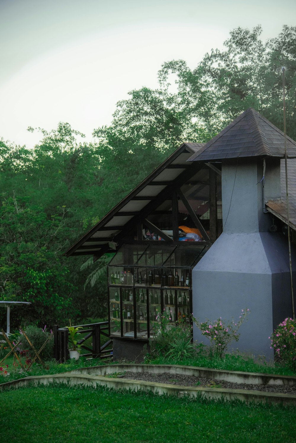 a small building with a clock on the front of it