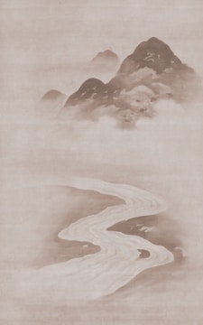Scenic mountain landscape in Asia with a winding river and misty peaks