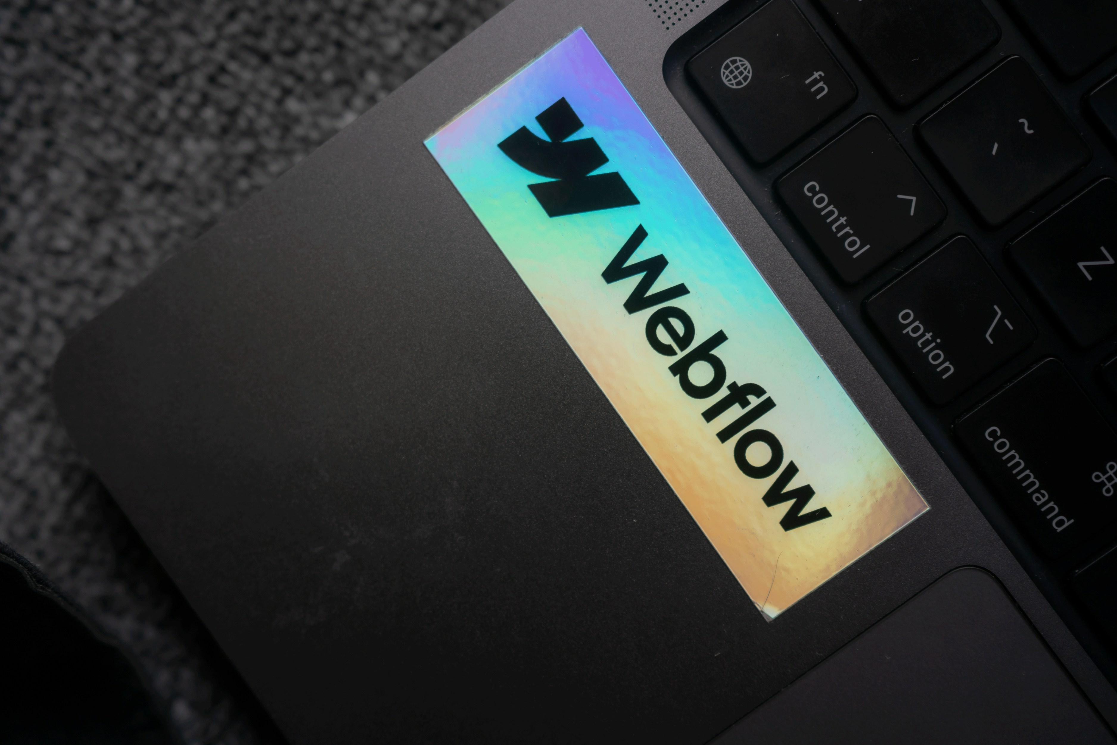 a close up of a laptop with a sticker on it