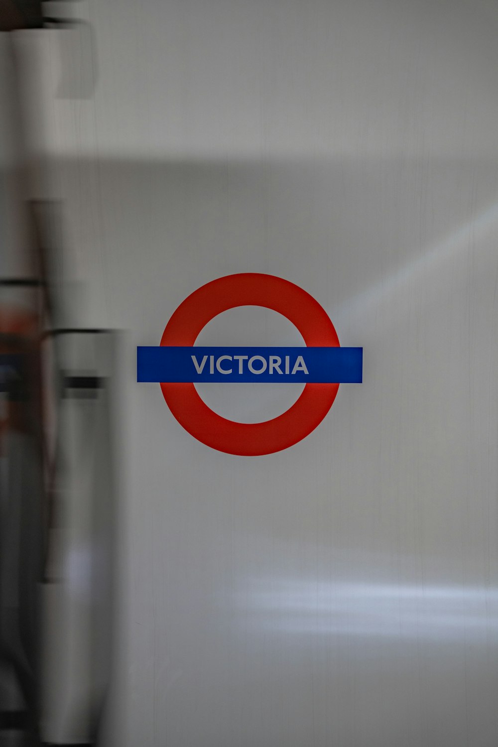 a red and blue sign that says victoria on it