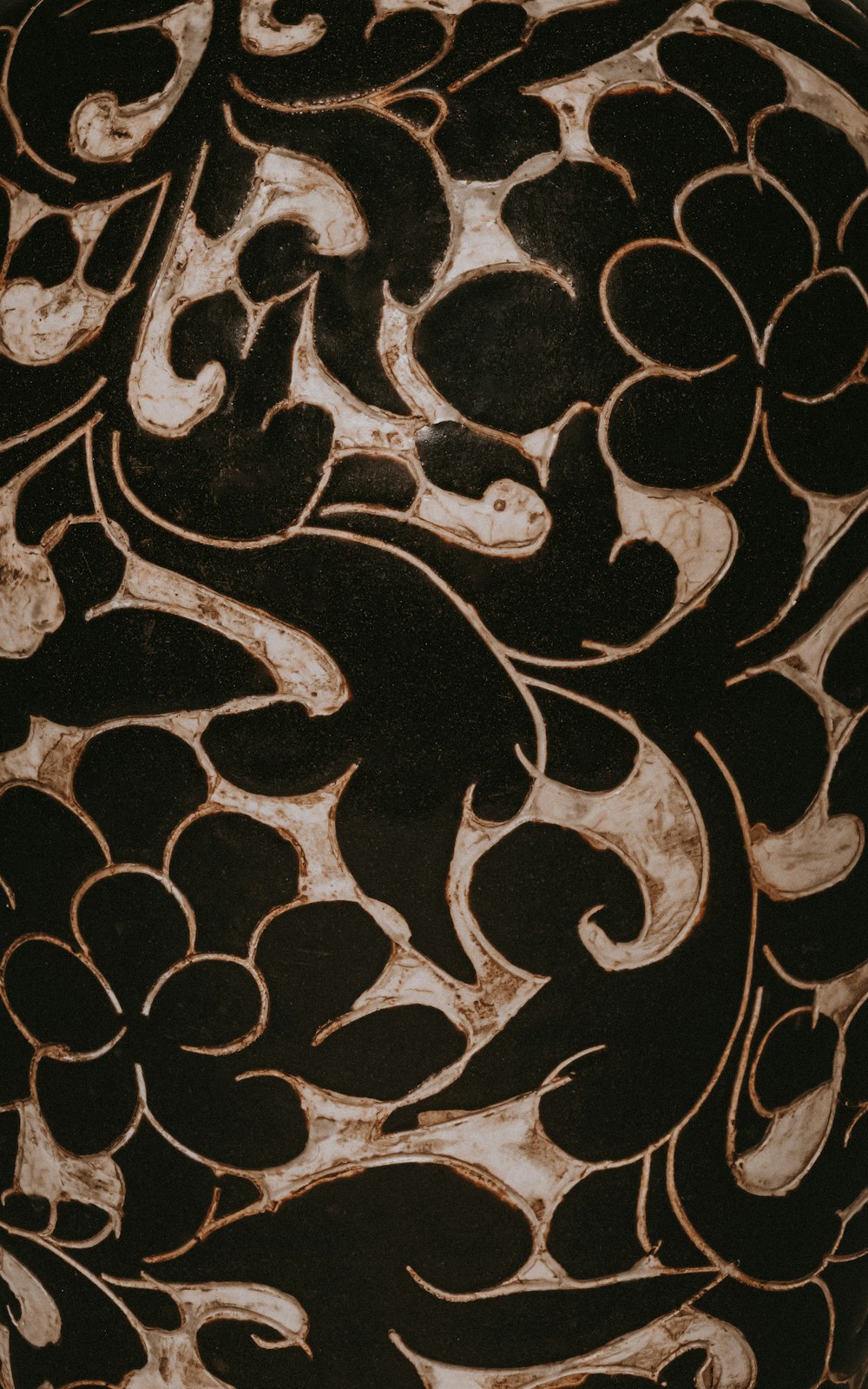 a close up of a vase with a design on it