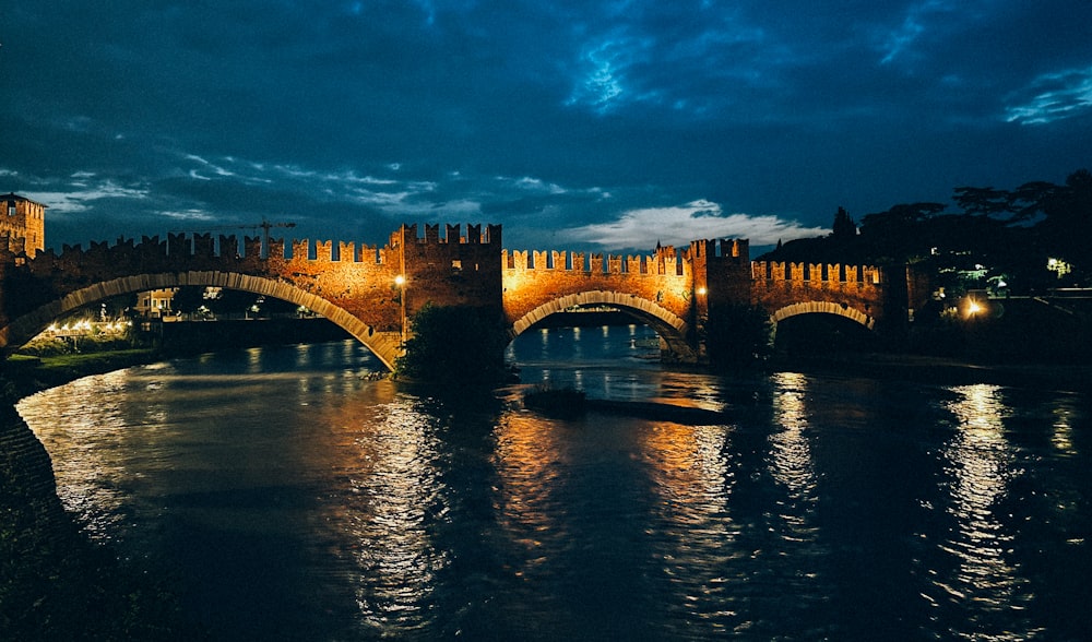 a bridge over a body of water at night