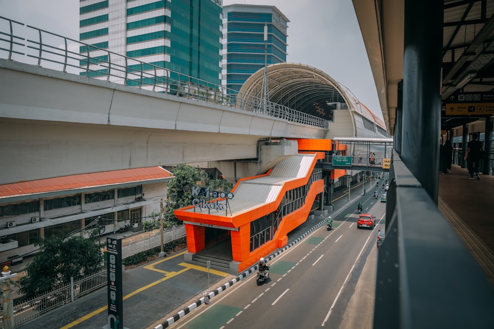 an orange and white building on the side of a road