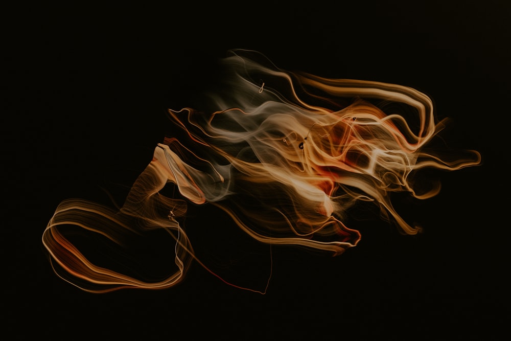 a blurry photo of a fire on a black background