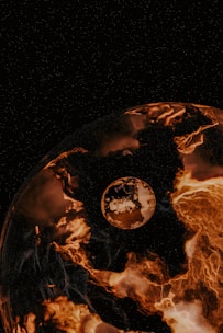 A planet-like sphere dominates the foreground, appearing to be engulfed in fiery, molten lava-like textures. Beyond, a smaller celestial body hovers in space, surrounded by a dark starry sky. The overall scene gives an impression of cosmic intensity and otherworldly beauty.