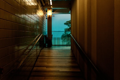 Warmly lit hallway with sustainable materials and soft textures.