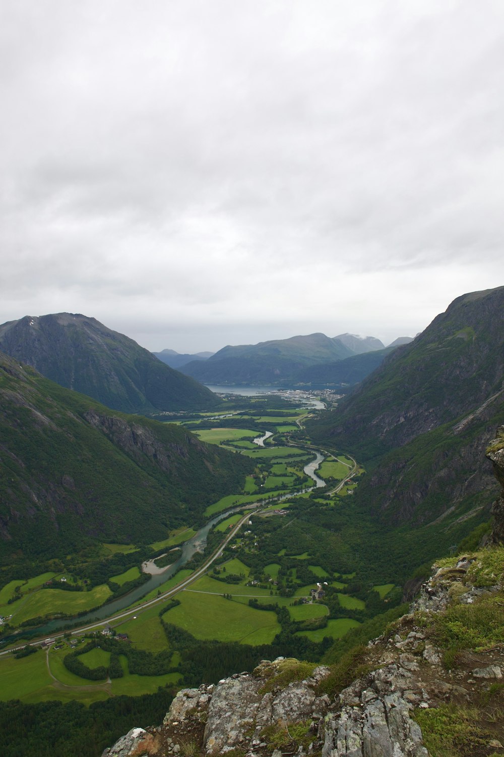 a view of a valley with a river running through it