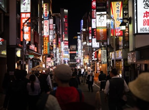 a city street filled with lots of neon signs