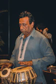 Close-up of hands expertly playing the tabla during a classical music session